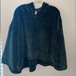 Crop-ish in the front, dark green soft material